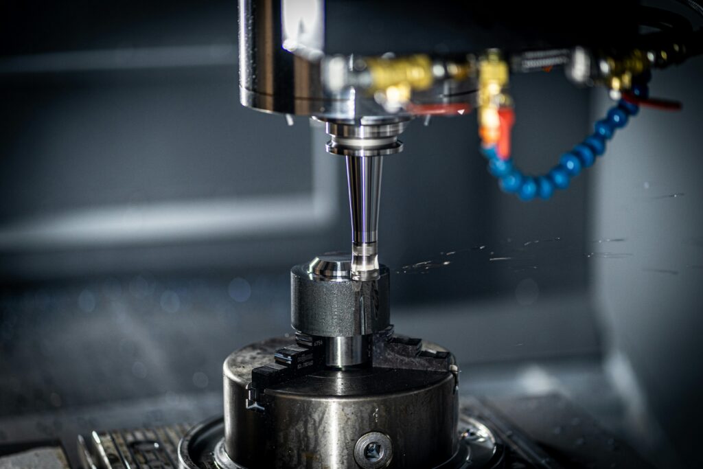 corporate Close-up of CNC machine in action, showcasing precision engineering and industrial equipment.